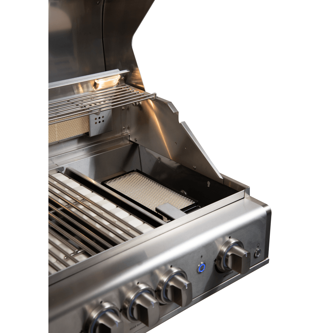 Interior view of Cuisinart Arkton gas grill showing burners, grates, and accessories for grilling.