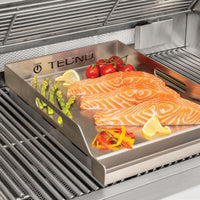 Churrasqueira Tecno em aço inox 304 com chapa para grelhar salmão, tomates e aspargos — 3 queimadores, design profissional