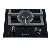 Cooktop Dominó a Gás Tecno 2 Bocas Vitrocerâmico 30cm em vitrocerâmica preta com trempes ferro fundido, dois queimadores e acendimento super automático