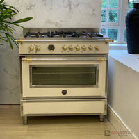 Fogão Bertazzoni Heritage Marfim 90cm 6 Bocas Forno Elétrico 103L — fogão de piso marfim com acabamento inox, puxadores dourados e grelhas em ferro fundido