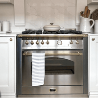 Fogão Lofra Dolcevita Inox 90cm 5 Bocas Forno Elétrico 102L em inox de piso com 5 bocas, grelhas robustas, puxadores dourados e painel analógico