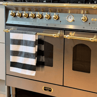 Fogão Lofra Dolcevita Inox 90cm 5 Bocas Forno Duplo Elétrico 106L — fogão de piso inox 5 bocas com puxadores e botões dourados, forno duplo elétrico