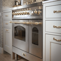 Fogão Lofra Dolcevita Inox 90cm 5 Bocas Forno Duplo Elétrico 106L em inox de piso com 5 bocas, painel cromado, puxadores dourados e forno duplo.