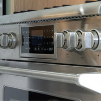 Fogão Evol Profissional inox 6 bocas com painel digital, forno elétrico 163L e botões de controle em close