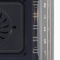 Forno Bertazzoni Heritage Elétrico a Vapor 76 Litros Marfim 60cm mostrando interior em inox com trilhos numerados e ventilador traseiro